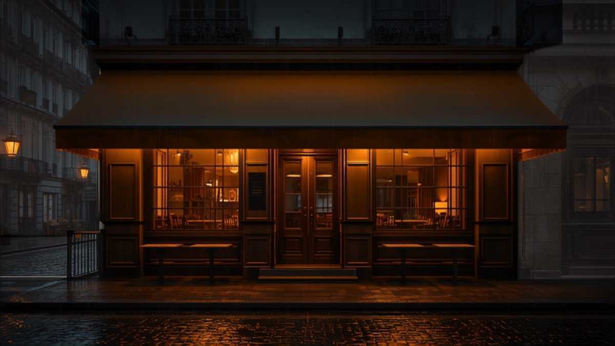 Devanture chaleureuse d’un restaurant éclairée sur des pavés mouillés